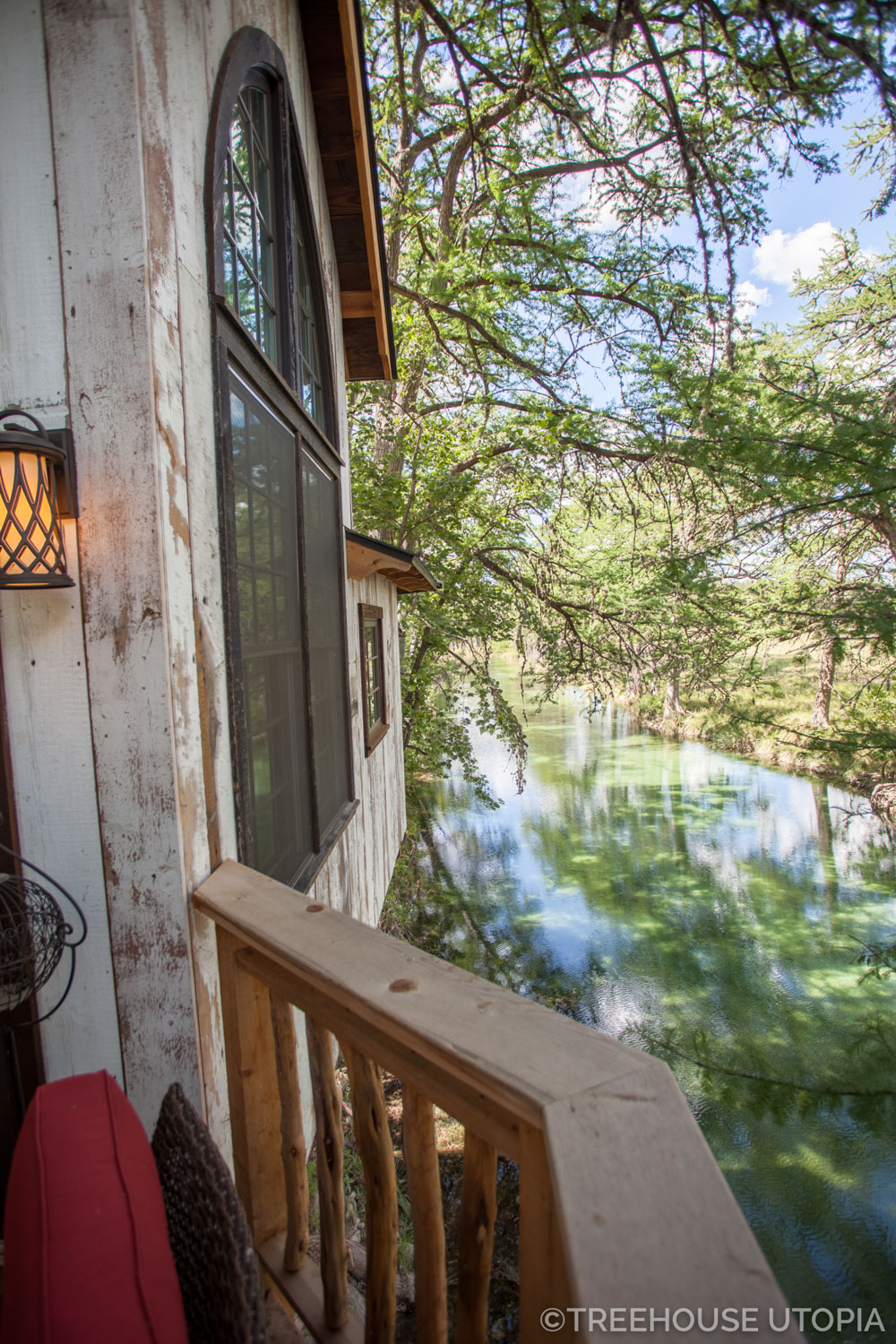  View of the river from back deck on Chapelle at Treehouse Utopia, a Texas Hill Country Retreat. Photo by Nelson Treehouse. 