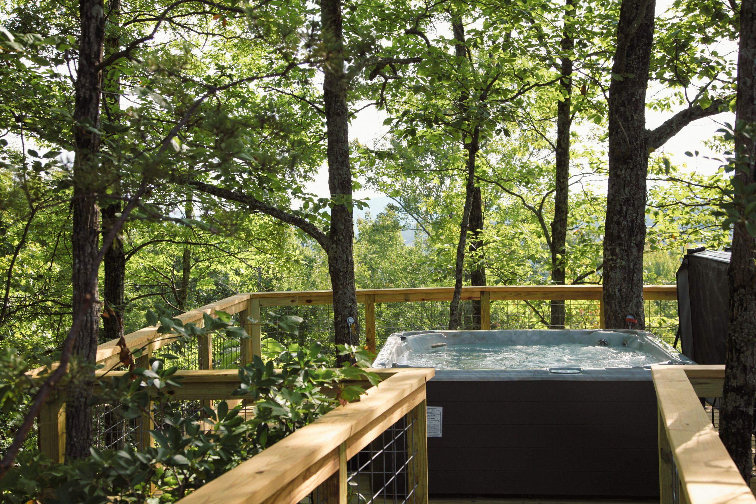 elevated hot tub in the trees